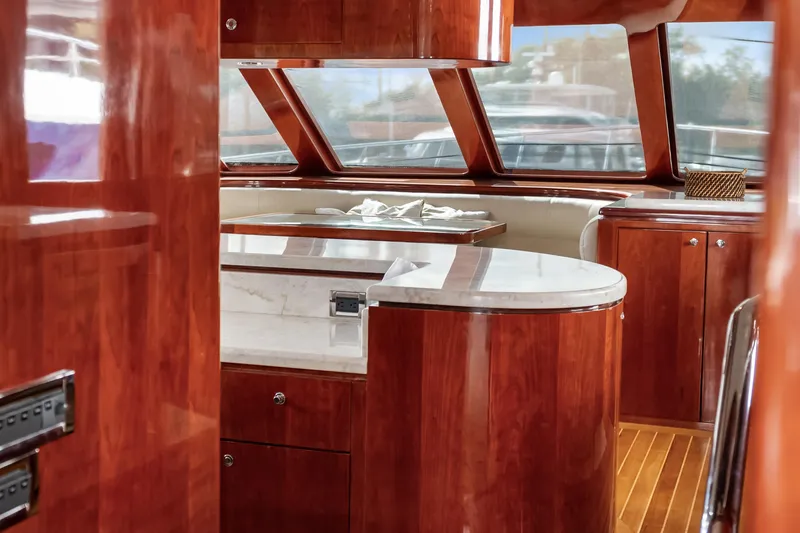 Yacht Photos Pics Luxurious interior of 2005 Ocean Alexander 80 Motoryacht with polished wood and marble finishes.