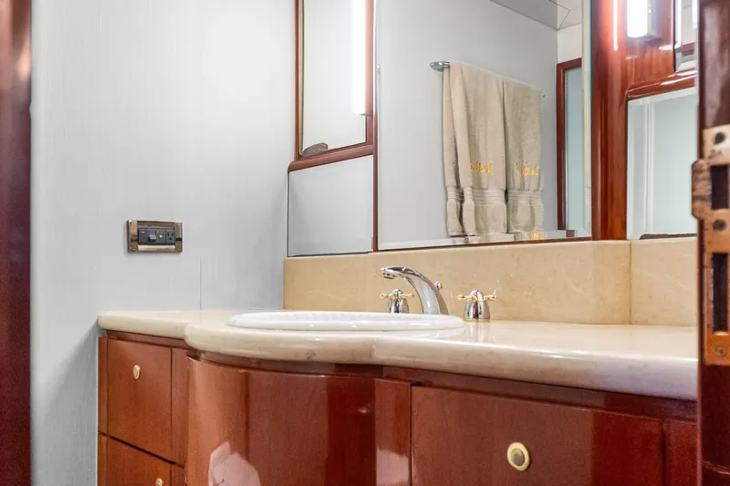  Yacht Photos Pics Luxurious bathroom in 2005 Ocean Alexander 80 Motoryacht with elegant fixtures and wood cabinetry.