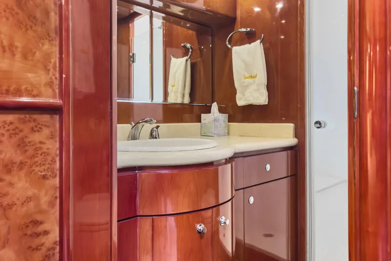  Yacht Photos Pics Luxurious bathroom interior of 2005 Ocean Alexander 80 Motoryacht with elegant wood finish.