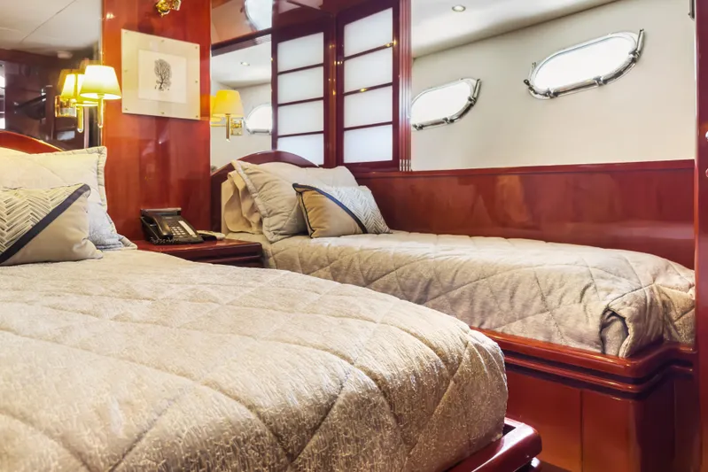  Yacht Photos Pics Luxurious bedroom interior of 2005 Ocean Alexander 80 Motoryacht with elegant wood finishes.