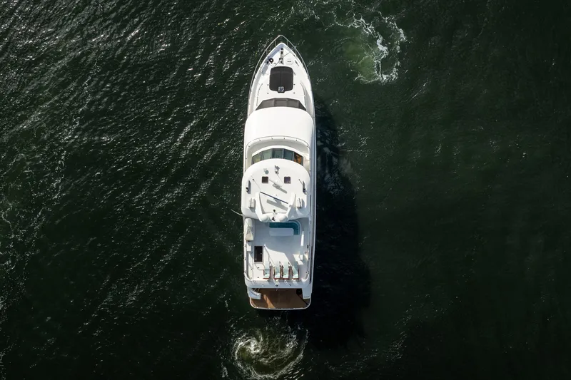  Yacht Photos Pics Aerial view of 2005 Ocean Alexander 80 Motoryacht cruising on open water.