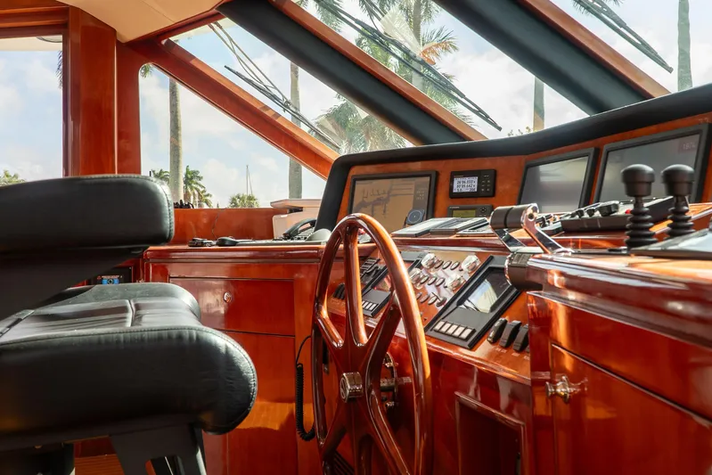  Yacht Photos Pics Luxurious helm of 2005 Ocean Alexander 80 Motoryacht with polished wood and advanced controls.