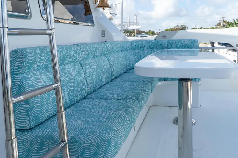  Yacht Photos Pics Ocean Alexander 80 Motoryacht 2005, outdoor seating with patterned cushions and table.