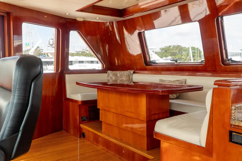  Yacht Photos Pics Luxurious interior of 2005 Ocean Alexander 80 Motoryacht with polished wood and plush seating.