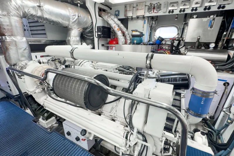  Yacht Photos Pics Engine room of 2005 Ocean Alexander 80 Motoryacht, showcasing mechanical components and piping.