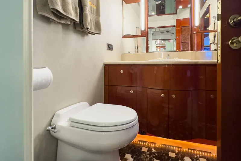  Yacht Photos Pics Luxurious bathroom in 2005 Ocean Alexander 80 Motoryacht with elegant wood cabinetry.