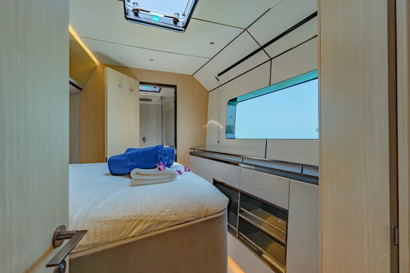 Jack Yacht Photos Pics Luxurious 2023 McConaghy MC75 yacht bedroom with modern design and large window.