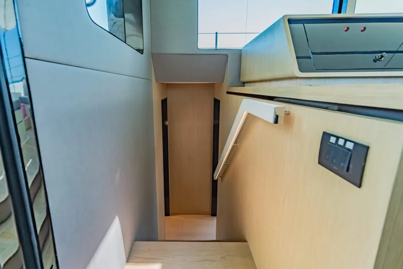 Jack Yacht Photos Pics Interior staircase of 2023 McConaghy MC75 yacht, featuring modern design and wood finish.