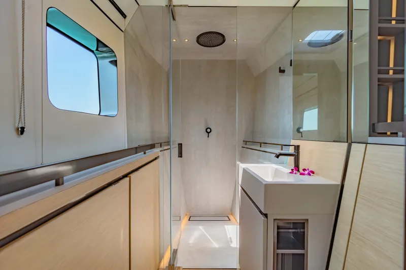 Jack Yacht Photos Pics Luxurious bathroom interior of 2023 McConaghy MC75 yacht with modern shower and sink.