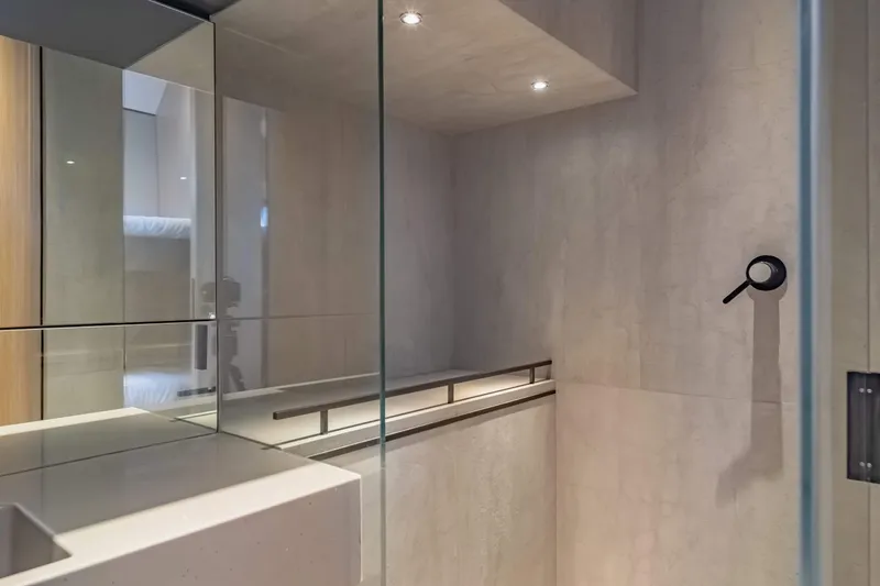 Jack Yacht Photos Pics Modern bathroom interior in 2023 McConaghy MC75 yacht, featuring sleek design and glass elements.