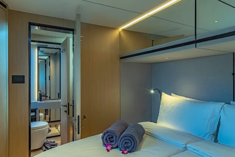 Jack Yacht Photos Pics Luxurious 2023 McConaghy MC75 yacht bedroom with modern design and ensuite bathroom.