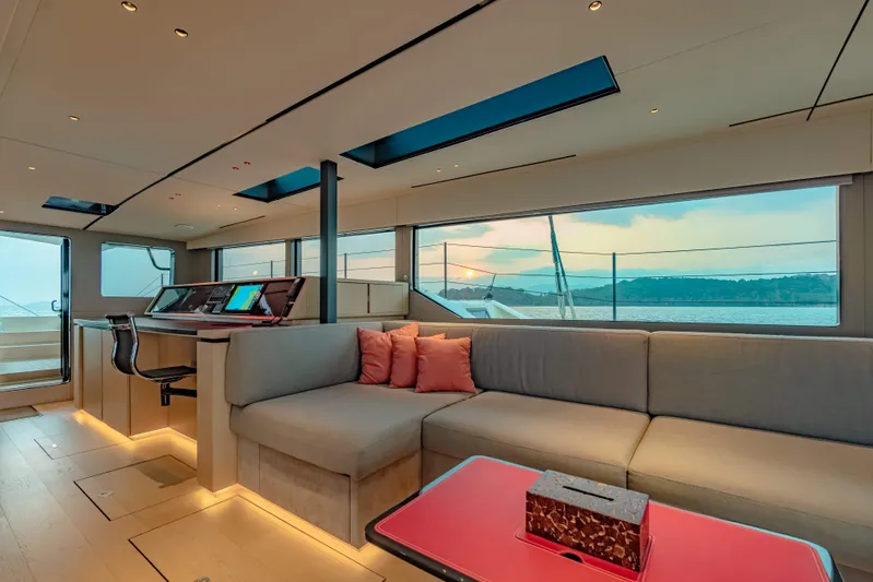 Jack Yacht Photos Pics Luxurious interior of 2023 McConaghy MC75 yacht with modern seating and panoramic windows.