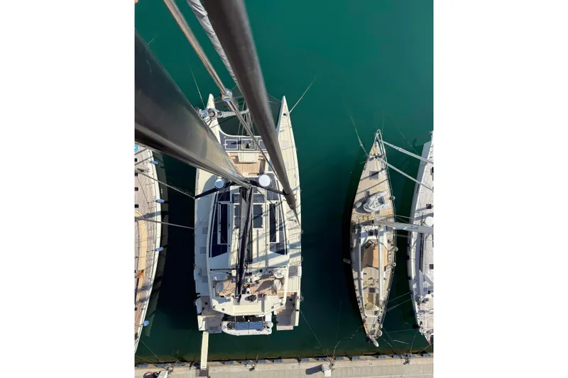 Jack Yacht Photos Pics Aerial view of 2023 McConaghy MC75 yacht docked among sailboats.