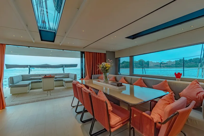 Jack Yacht Photos Pics Luxurious interior of 2023 McConaghy MC75 yacht with elegant dining area and ocean view.