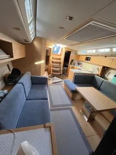 Le Joy Yacht Photos Pics Interior of 2018 Grand Soleil 48 yacht with modern furnishings and ample seating.