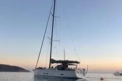 Le Joy Yacht Photos Pics Grand Soleil 48 sailboat on calm water at sunset, 2018 model.