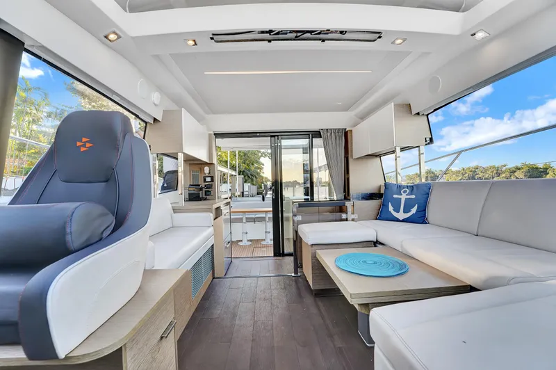 E Komo Mai Yacht Photos Pics Luxurious interior of 2022 Prestige 420S yacht with modern seating and decor.