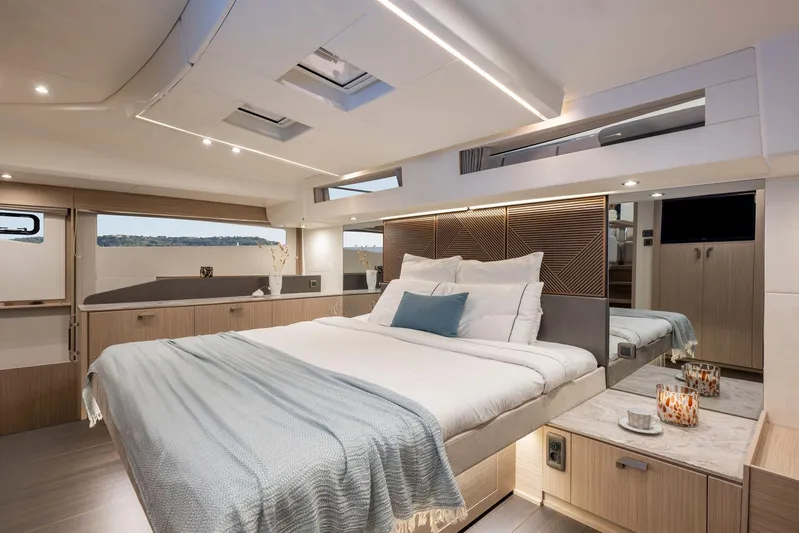  Yacht Photos Pics Luxurious bedroom interior of 2026 Prestige M48 yacht, featuring modern design and elegant decor.