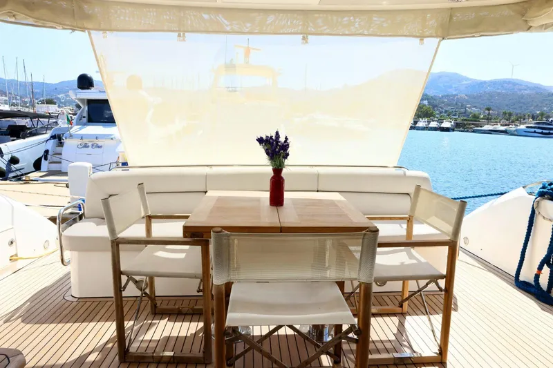  Yacht Photos Pics Luxurious Sunseeker Manhattan 63 yacht deck with elegant dining area, 2012 model.