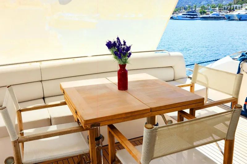  Yacht Photos Pics Luxury yacht Sunseeker Manhattan 63, 2012, with elegant outdoor dining area and sea view.