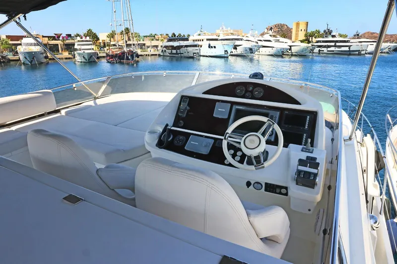  Yacht Photos Pics Luxurious 2012 Sunseeker Manhattan 63 yacht helm with marina view.