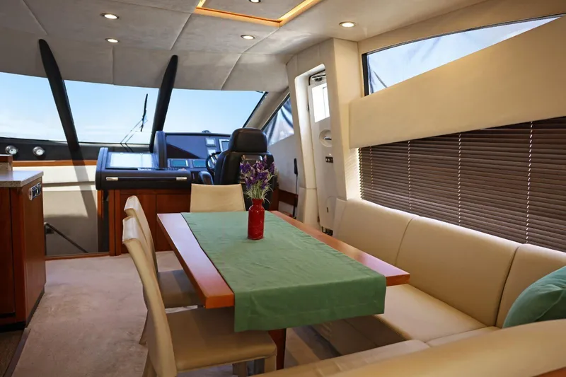  Yacht Photos Pics Luxurious interior of 2012 Sunseeker Manhattan 63 yacht with elegant dining area.