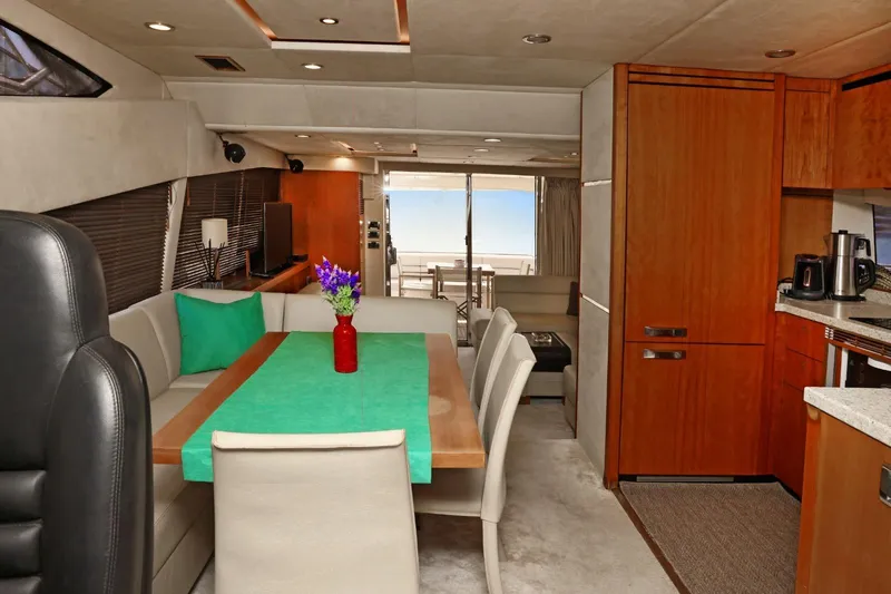  Yacht Photos Pics Luxurious interior of 2012 Sunseeker Manhattan 63 yacht with modern dining area and kitchen.