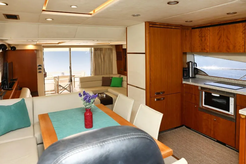  Yacht Photos Pics Luxurious interior of 2012 Sunseeker Manhattan 63 yacht with modern kitchen and seating area.