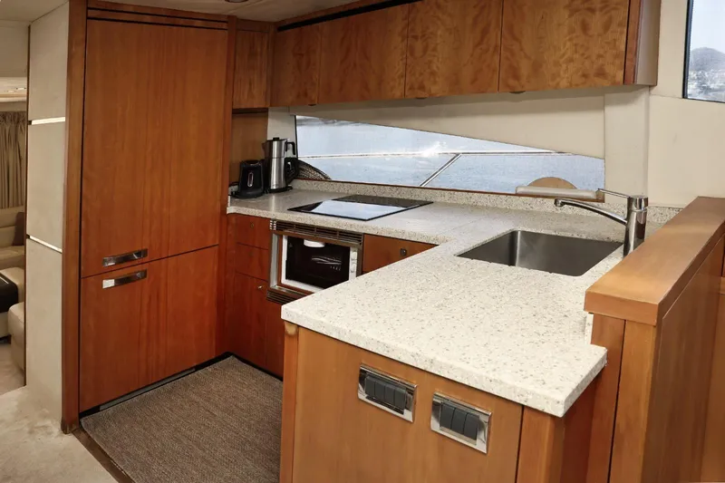  Yacht Photos Pics Luxurious kitchen interior of 2012 Sunseeker Manhattan 63 yacht with modern amenities.