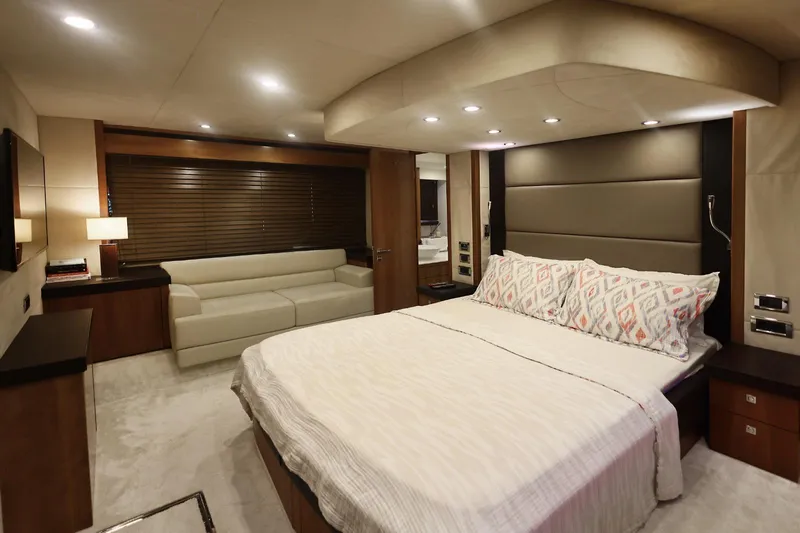  Yacht Photos Pics Luxurious bedroom interior of 2012 Sunseeker Manhattan 63 yacht with modern decor.
