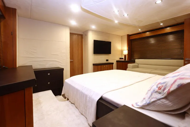  Yacht Photos Pics Luxurious bedroom interior of 2012 Sunseeker Manhattan 63 yacht with modern furnishings.