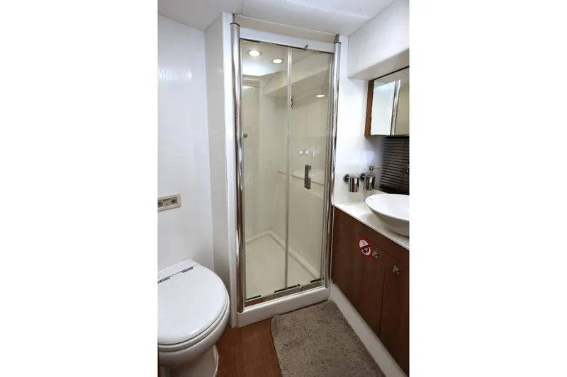  Yacht Photos Pics Luxurious bathroom in 2012 Sunseeker Manhattan 63 yacht with modern shower and fixtures.