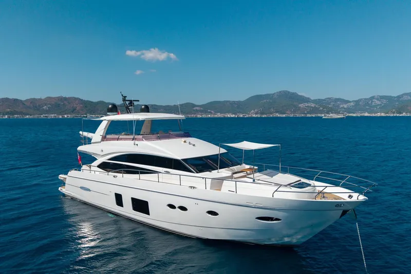 My Lady Yacht Photos Pics 2014 Princess 72 Flybridge Motor Yacht on serene blue waters with scenic mountain backdrop.