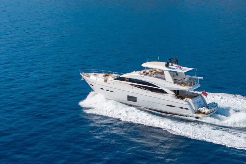 My Lady Yacht Photos Pics Luxurious 2014 Princess 72 Flybridge Motor Yacht cruising on open blue sea.
