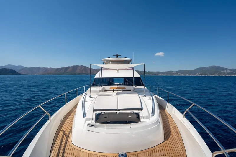 My Lady Yacht Photos Pics 2014 Princess 72 Flybridge Motor Yacht cruising on open sea with scenic mountain backdrop.