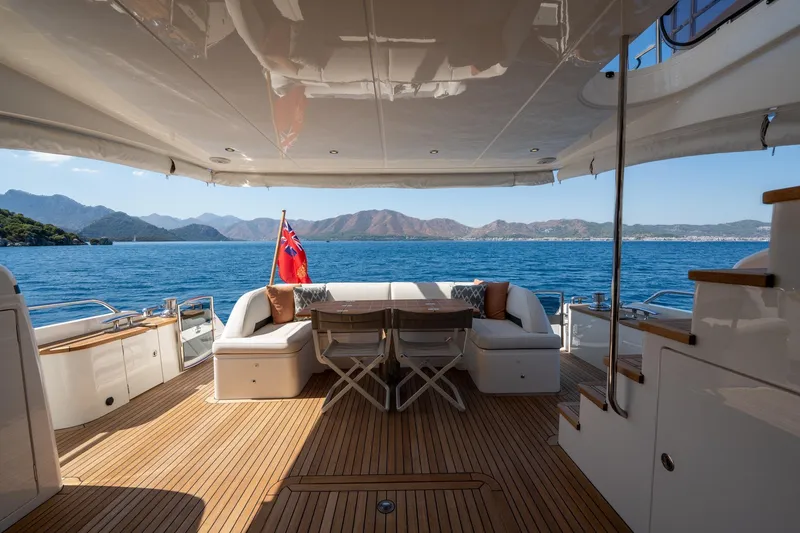 My Lady Yacht Photos Pics Luxurious 2014 Princess 72 Flybridge Motor Yacht with scenic ocean view and elegant deck seating.