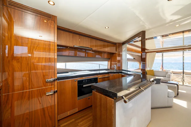 My Lady Yacht Photos Pics Luxurious interior of 2014 Princess 72 Flybridge Motor Yacht with modern kitchen and ocean view.