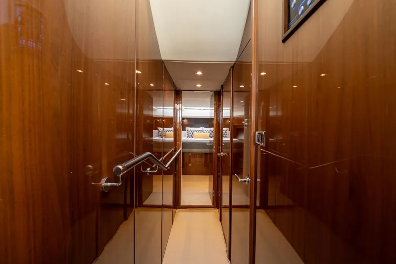 My Lady Yacht Photos Pics Luxurious hallway inside 2014 Princess 72 Flybridge Motor Yacht with polished wood finish.