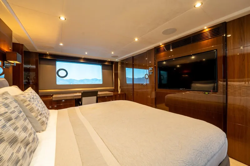 My Lady Yacht Photos Pics Luxurious bedroom in 2014 Princess 72 Flybridge Motor Yacht with elegant decor and large window.