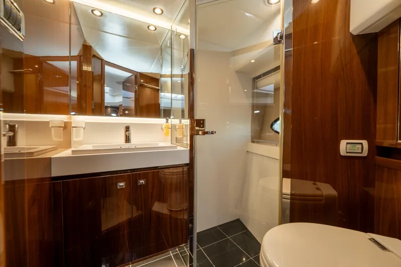 My Lady Yacht Photos Pics Luxurious bathroom in 2014 Princess 72 Flybridge Motor Yacht with elegant wood finishes.