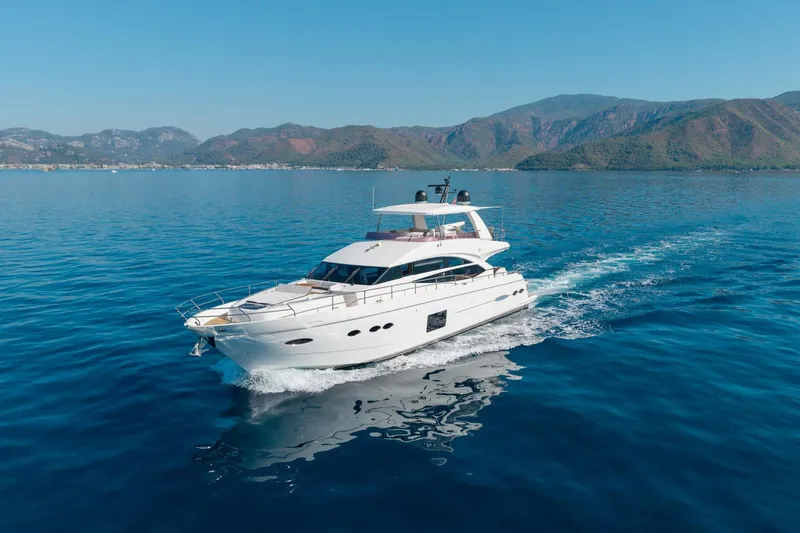 My Lady Yacht Photos Pics 2014 Princess 72 Flybridge Motor Yacht cruising on clear blue waters.