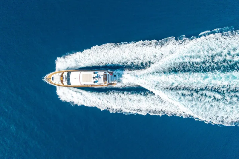 My Lady Yacht Photos Pics Aerial view of 2014 Princess 72 Flybridge Motor Yacht cruising on blue ocean.