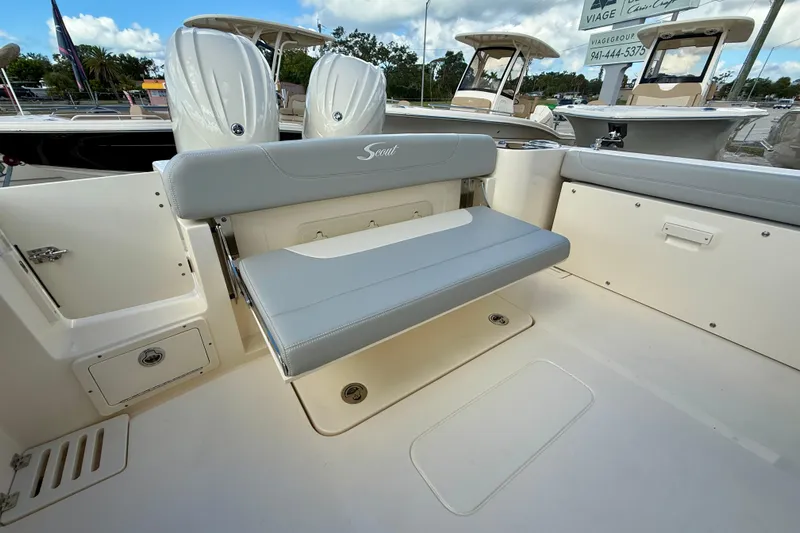  Yacht Photos Pics 2026 Scout 255 Dorado boat interior with foldable seating and storage compartments.