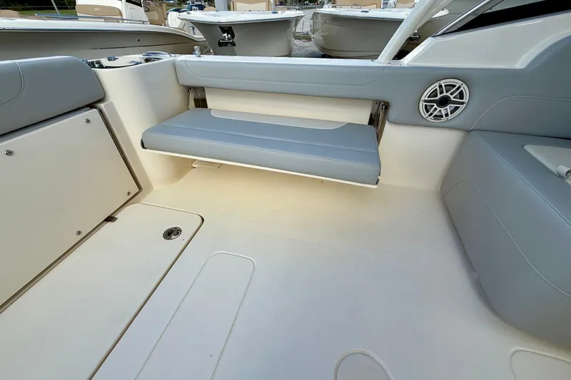  Yacht Photos Pics 2026 Scout 255 Dorado boat interior with gray seating and speaker detail.