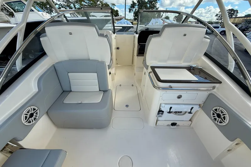  Yacht Photos Pics 2026 Scout 255 Dorado boat interior with seating, storage, and sleek design.