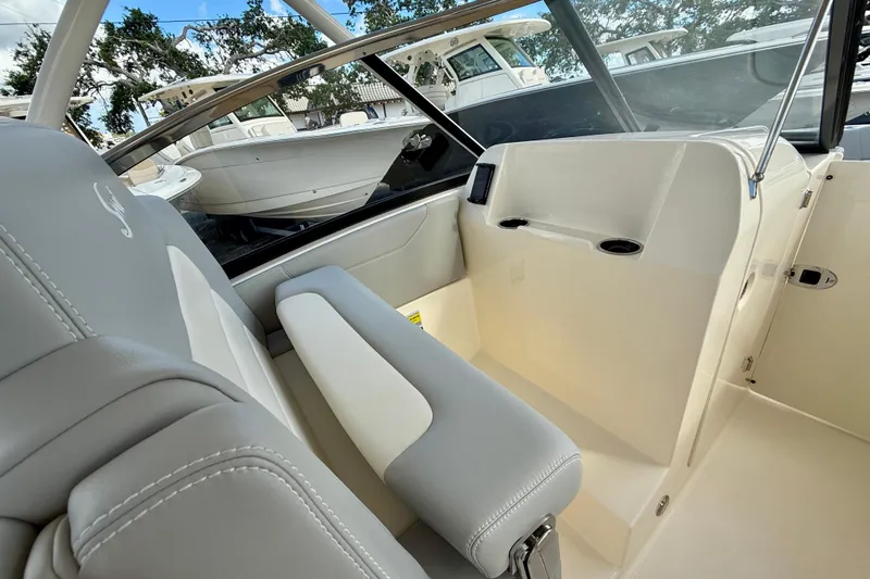 Yacht Photos Pics 2026 Scout 255 Dorado boat interior with sleek seating and modern design.