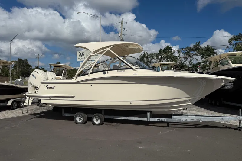  Yacht Photos Pics 2026 Scout 255 Dorado boat on trailer under blue sky.