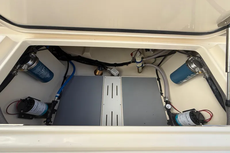  Yacht Photos Pics 2026 Scout 255 Dorado boat compartment with pumps and filters.