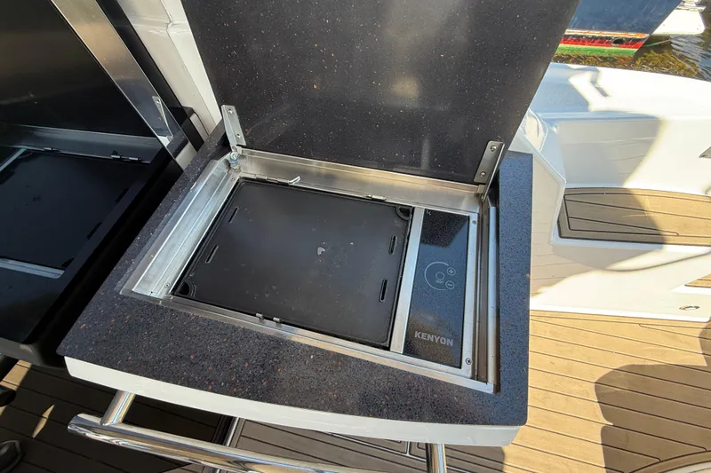  Yacht Photos Pics Kenyon grill on 2015 Regal 46 Sport Coupe yacht deck, open lid, sleek design.
