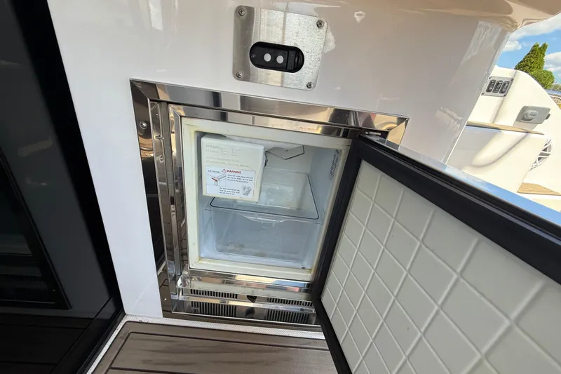  Yacht Photos Pics Open mini fridge on 2015 Regal 46 Sport Coupe yacht deck.